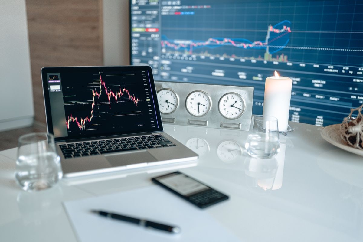 Financial trading workspace with multiple computer monitors