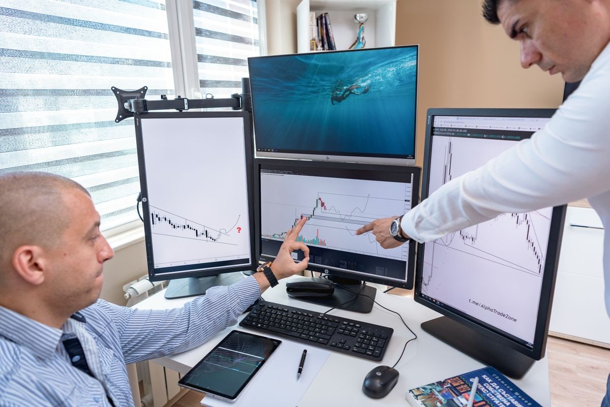 Desktop workstation with several financial trading screens